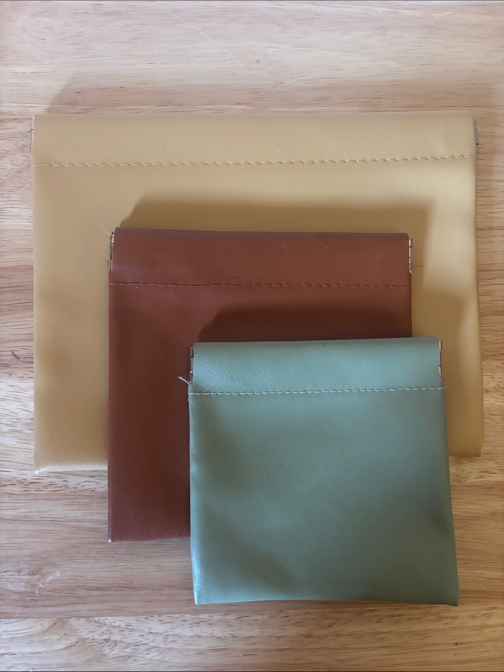 Set of Three Vegan Leather Pouches in Beige, Brown, and Sage. Organizers